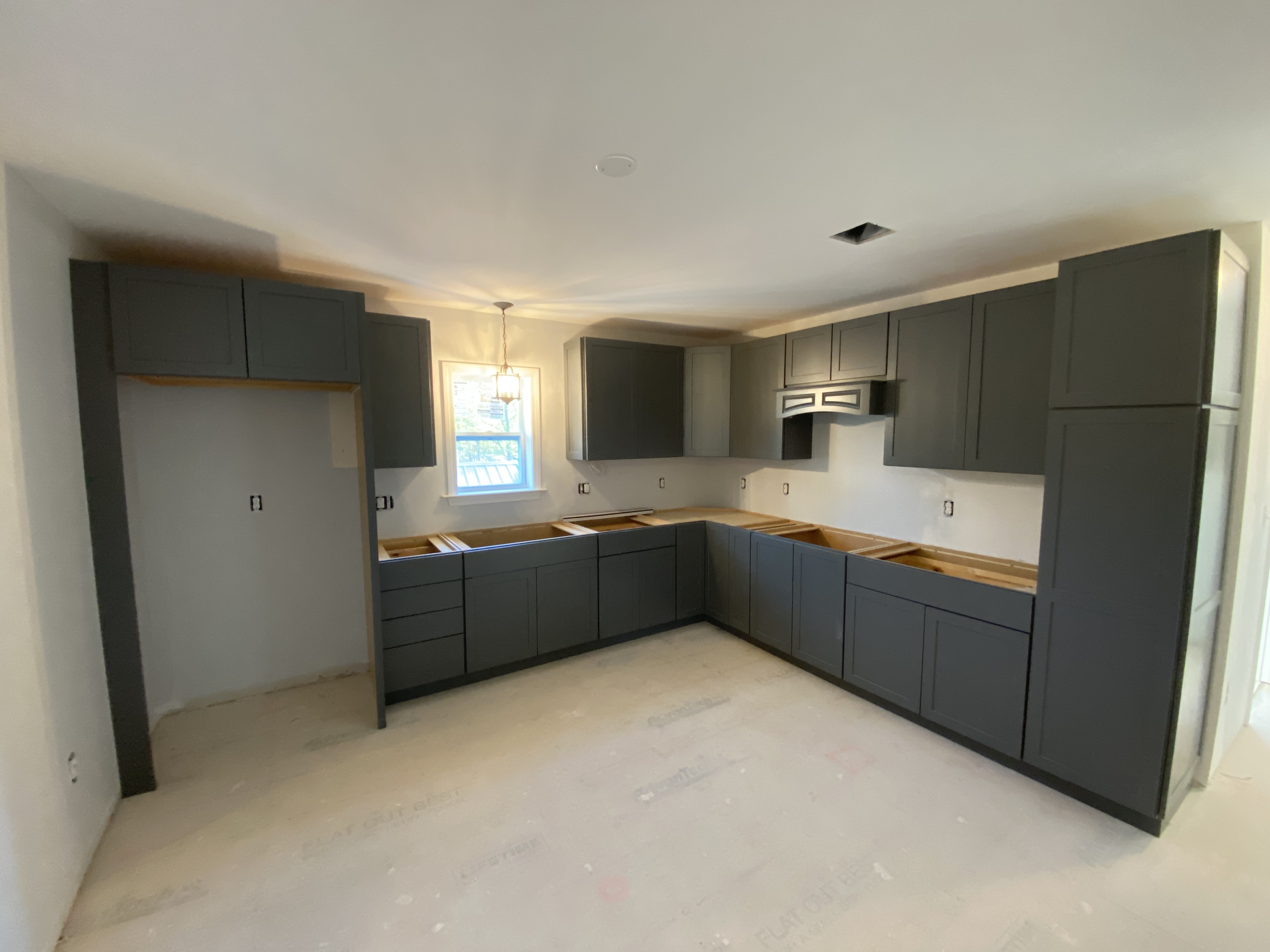 overview of remodeled kitchen without appliances or countertops